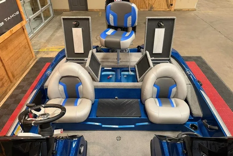 Slide: The Image of Interior of a 2026 Nitro Z17 boat with blue and gray seating. - 6