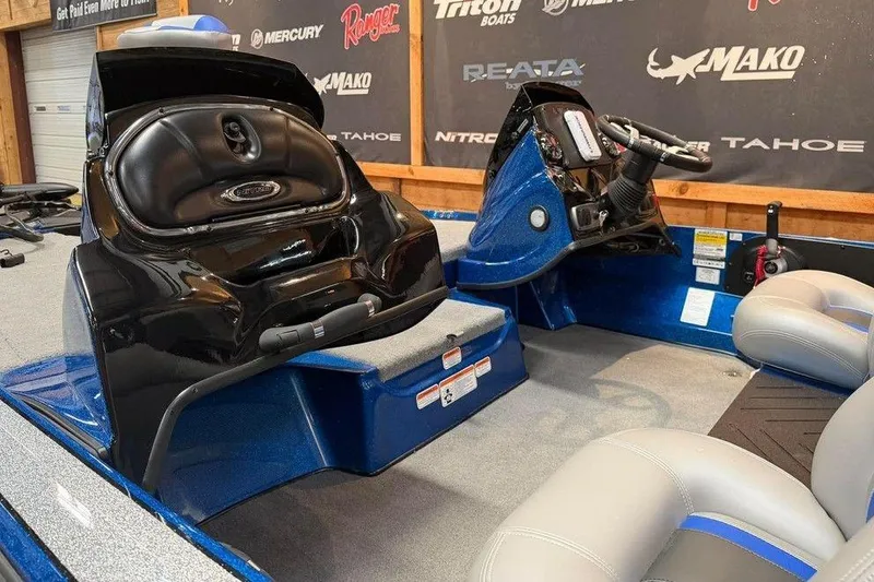 Slide: The Image of Interior of a 2026 Nitro Z17 boat with steering console and seating. - 7