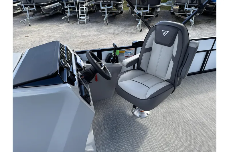 Slide: The Image of 2026 Viaggio Lago V 20 C boat interior with steering console and captain's chair. - 6