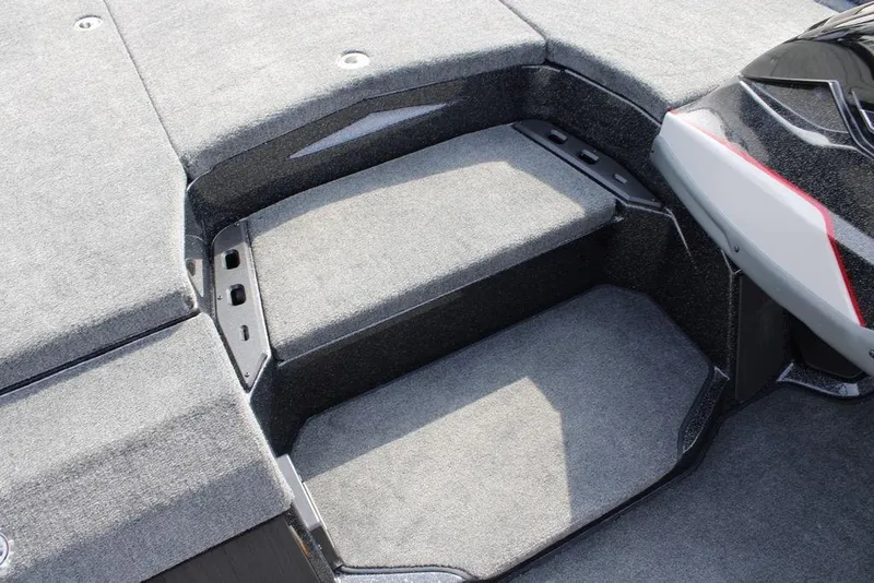 Slide: The Image of Interior view of 2026 Skeeter ZXE21 boat, featuring carpeted steps and sleek design. - 10