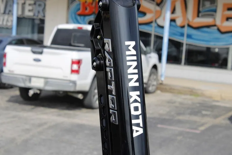 Slide: The Image of Minn Kota Raptor on Skeeter ZXE21, 2026 model, with truck in background. - 21