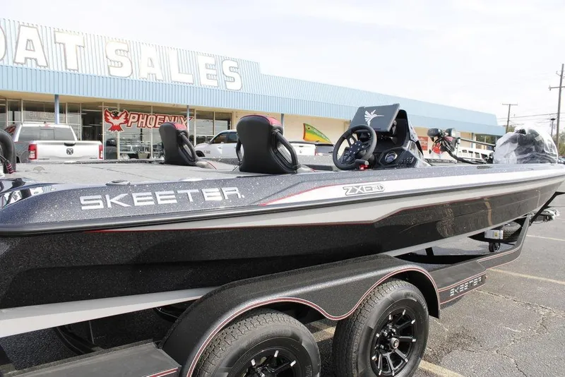 Slide: The Image of 2026 Skeeter ZXE21 boat displayed at a dealership, showcasing sleek design and modern features. - 23