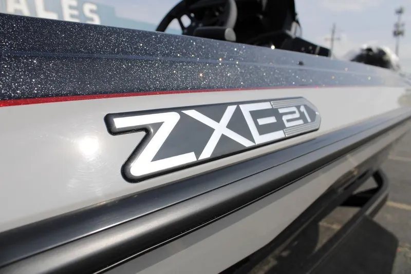 Slide: The Image of 2026 Skeeter ZXE21 boat logo on sleek, metallic surface. - 27