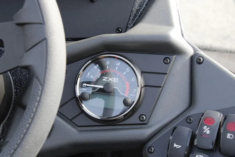 Slide: The Image of Dashboard of 2026 Skeeter ZXE21 showing RPM gauge and control buttons. - 28