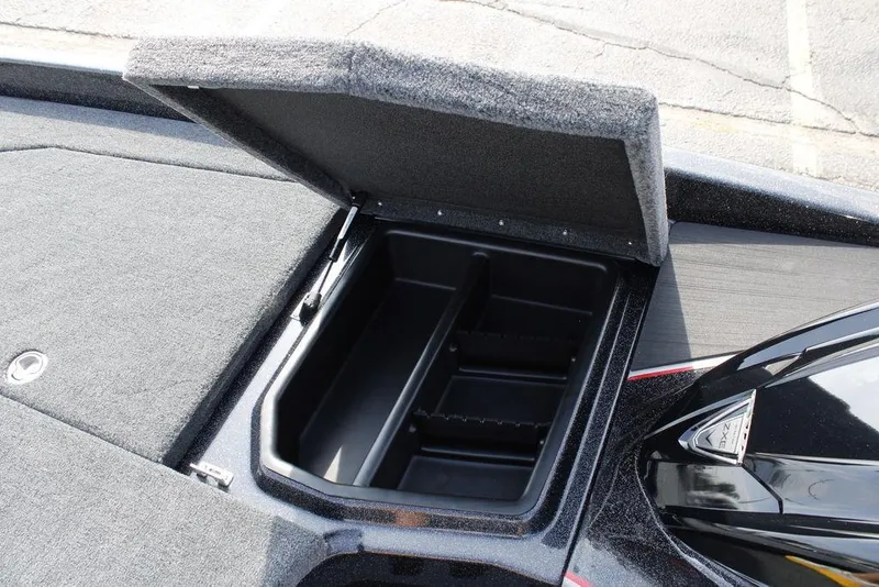 Slide: The Image of Open storage compartment on 2026 Skeeter ZXE21 boat deck. - 8