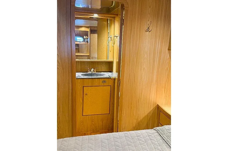 Slide: The Image of 1995 Symbol Pilothouse interior with wooden cabinetry and a small sink area. - 29