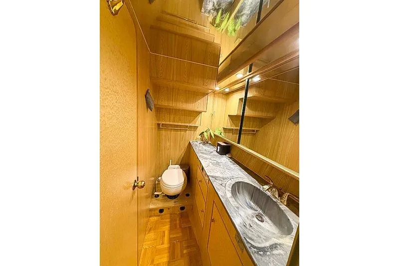 Slide: The Image of Luxurious 1995 Symbol Pilothouse bathroom with marble countertop and wooden cabinetry. - 30