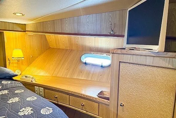 Slide: The Image of Interior of a 1995 Symbol Pilothouse yacht with wooden furnishings. - 34