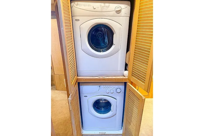 Slide: The Image of Stacked washer and dryer in wooden cabinet on a 1995 Symbol Pilothouse. - 37