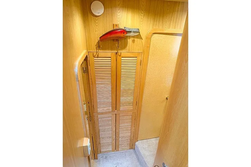 Slide: The Image of 1995 Symbol Pilothouse interior with wooden paneling and decorative fish. - 38