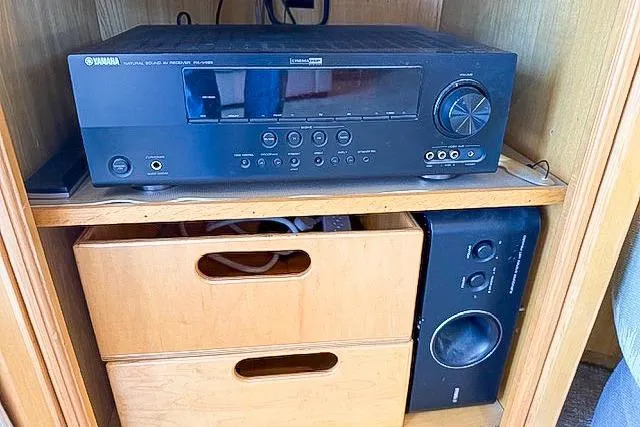 Slide: The Image of A Yamaha AV receiver and speaker system in a wooden cabinet, model Pilothouse, 1995. - 41