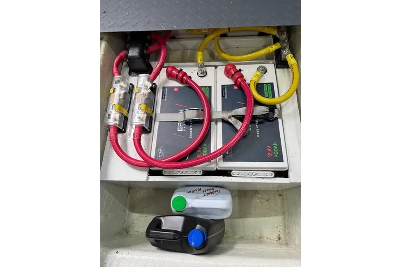 Slide: The Image of Electrical setup in a 1995 Symbol Pilothouse boat with batteries and cables. - 53