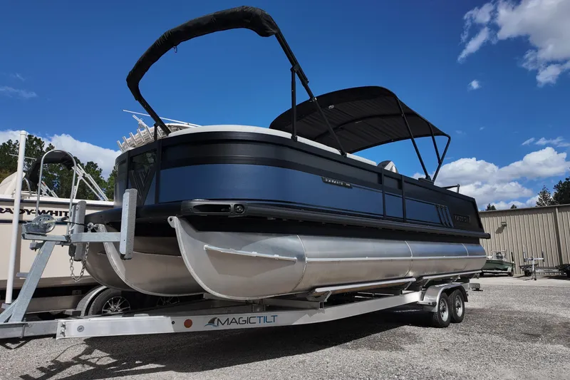 Slide: The Image of 2026 Viaggio Diamante 24S pontoon boat on trailer under blue sky. - 3