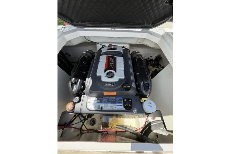 Slide: The Image of Engine compartment of 2022 Chaparral 23 SSi boat, featuring a 4.5L 250 HP engine. - 10