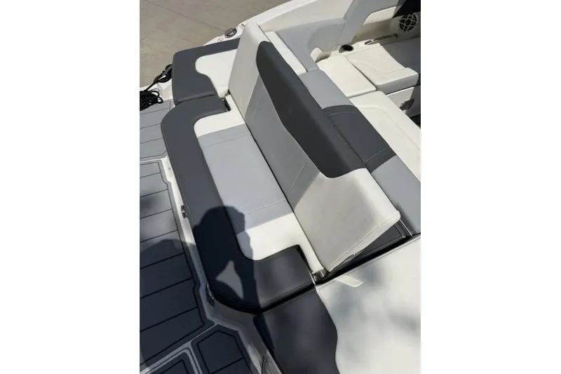 Slide: The Image of 2022 Chaparral 23 SSi boat interior with gray and white seating. - 14