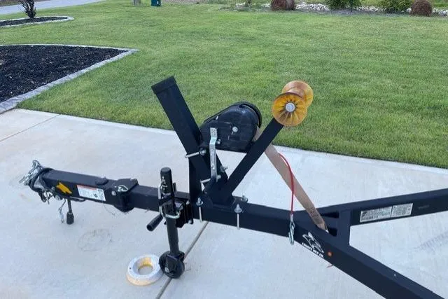Slide: The Image of Trailer hitch for 2022 Chaparral 23 SSi boat on driveway. - 21