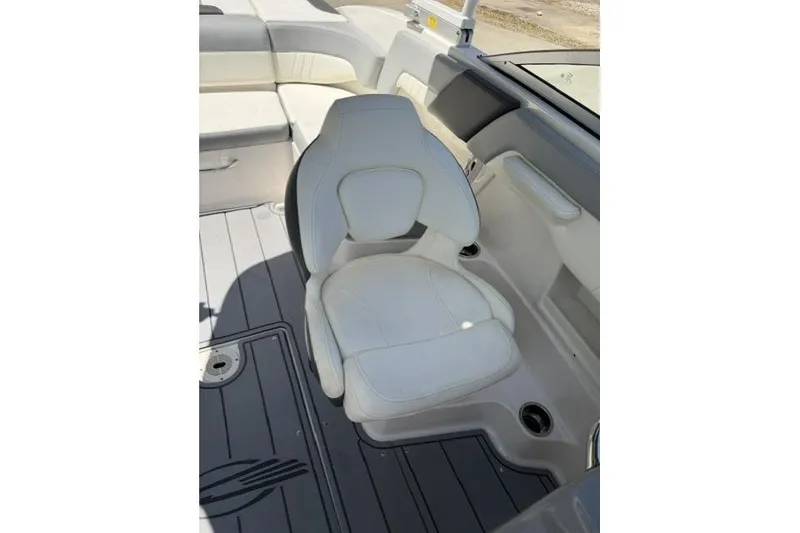 Slide: The Image of 2022 Chaparral 23 SSi boat interior with white seating and sleek design. - 7