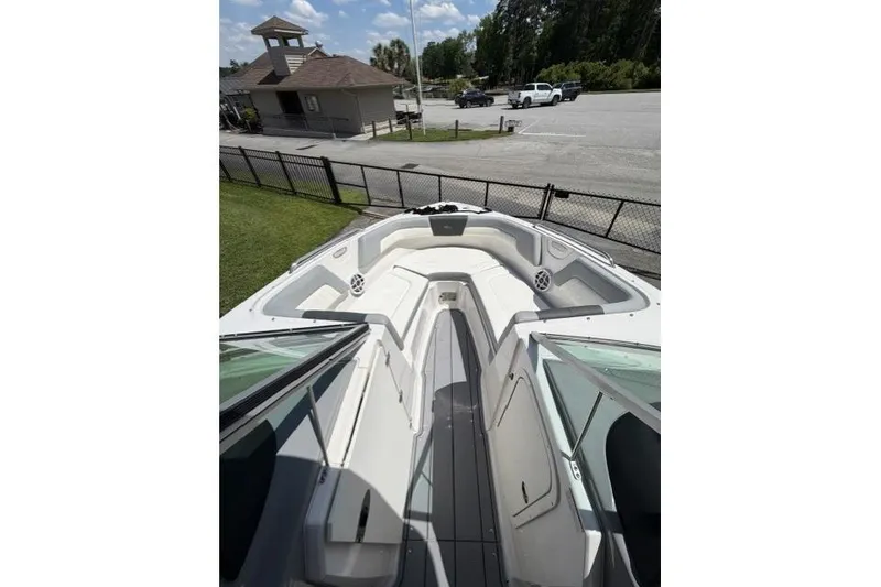 Slide: The Image of 2022 Chaparral 23 SSi boat interior with spacious seating and sleek design. - 9