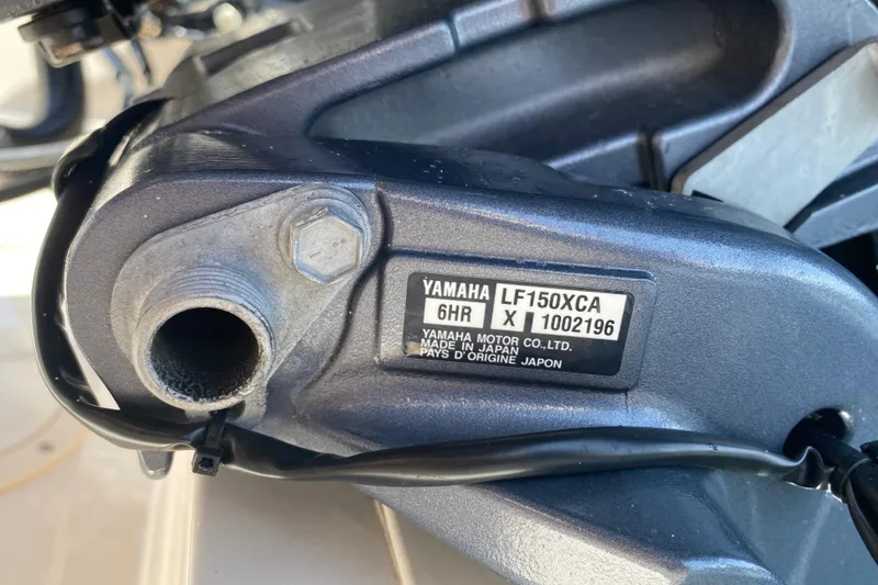 Slide: The Image of Close-up of Yamaha LF150XCA engine part on 2021 Grady-White Freedom 255 boat. - 25