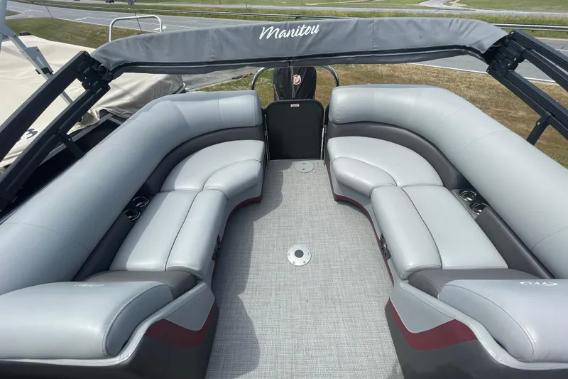 Slide: The Image of 2022 Manitou 23 Oasis pontoon boat with spacious seating and modern design. - 9