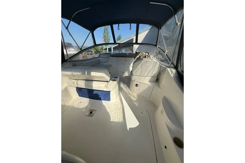 Slide: The Image of Interior view of 2003 Bayliner 2655 Ciera boat with seating and steering area. - 4
