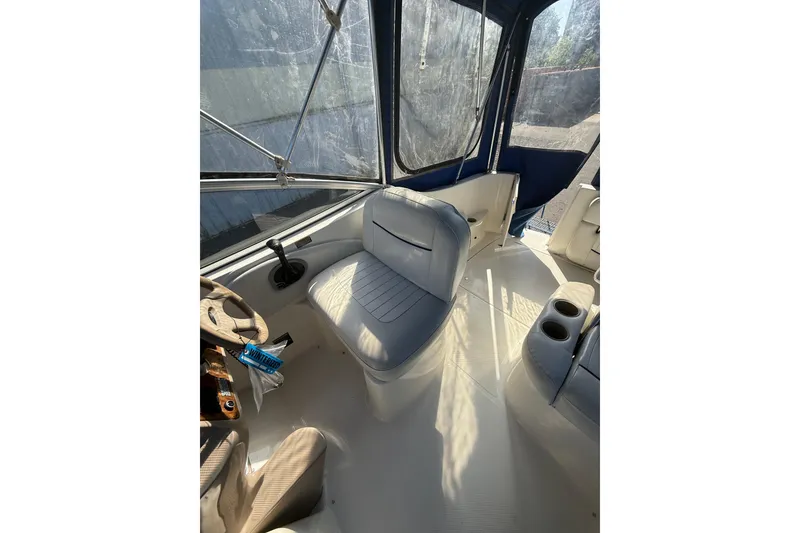 Slide: The Image of 2003 Bayliner 2655 Ciera boat interior with seating and steering wheel. - 6