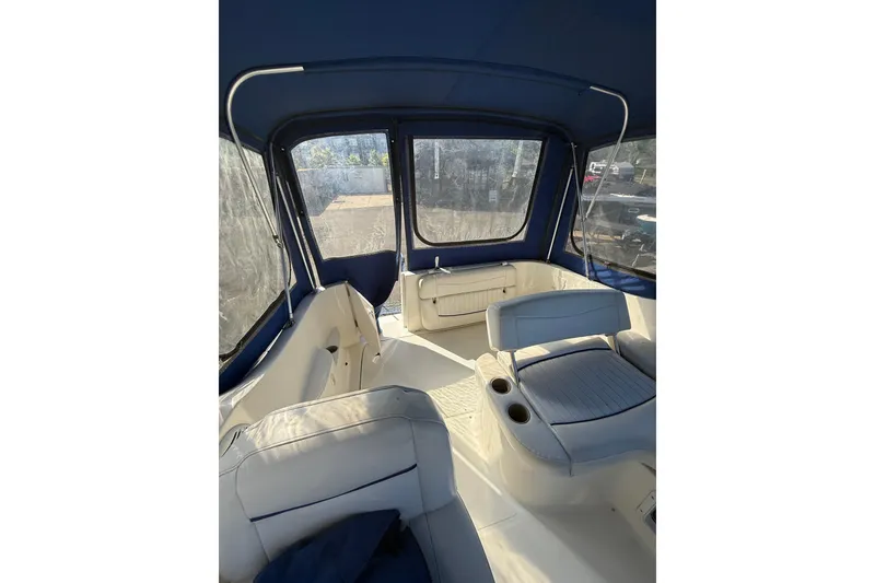 Slide: The Image of Interior view of 2003 Bayliner 2655 Ciera boat with blue canopy and seating. - 8