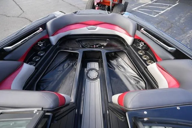 Slide: The Image of Interior of 2014 Supra Launch SA 350-550 boat with red and gray seating. - 10