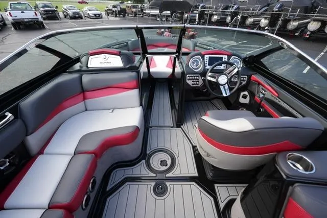 Slide: The Image of Interior of a 2014 Supra Launch SA 350-550 boat, featuring sleek seating and modern controls. - 12