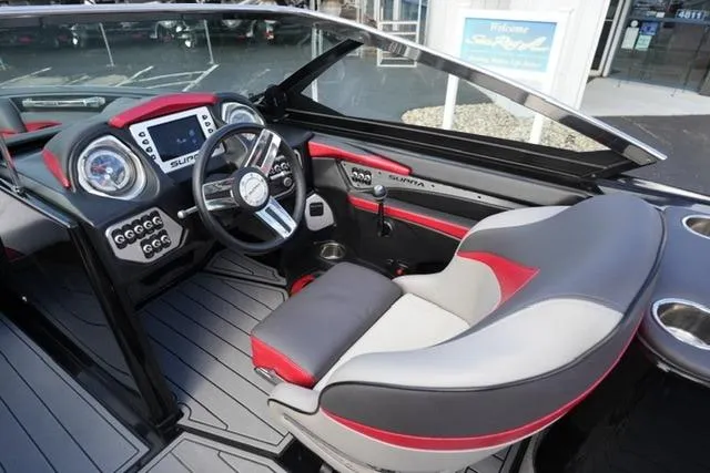Slide: The Image of 2014 Supra Launch SA 350-550 boat interior with modern dashboard and steering wheel. - 13