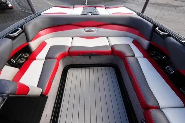 Slide: The Image of 2014 Supra Launch SA 350-550 boat interior with red, white, and gray seating. - 15