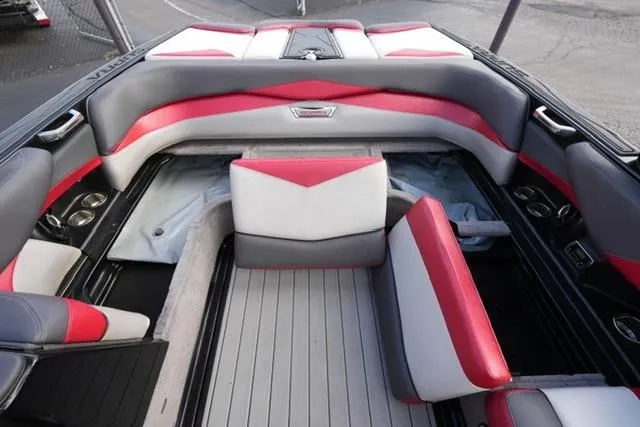 Slide: The Image of 2014 Supra Launch SA 350-550 boat interior with red and gray seating, sleek design. - 16