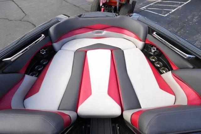 Slide: The Image of 2014 Supra Launch SA 350-550 boat interior with red, white, and gray seating design. - 9