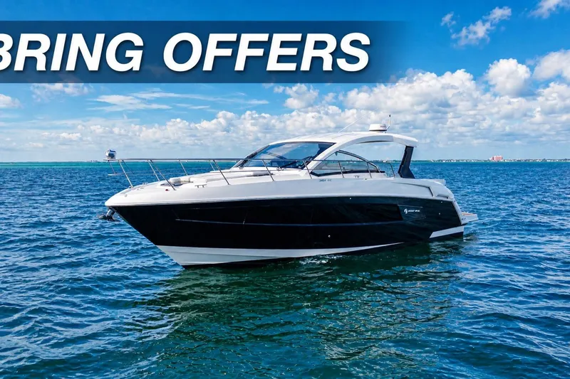 The Image of 2018 Cruisers Yachts 390 Express Coupe on open water under blue sky. - 0