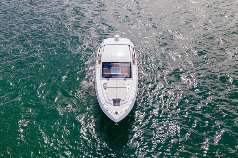Slide: The Image of 2018 Cruisers Yachts 390 Express Coupe on open water, aerial view. - 14