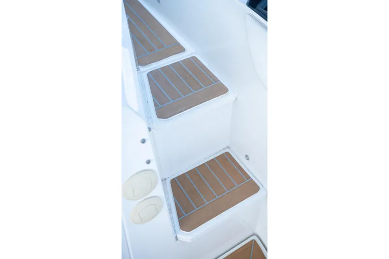 Slide: The Image of Steps on 2018 Cruisers Yachts 390 Express Coupe with teak-style decking. - 19