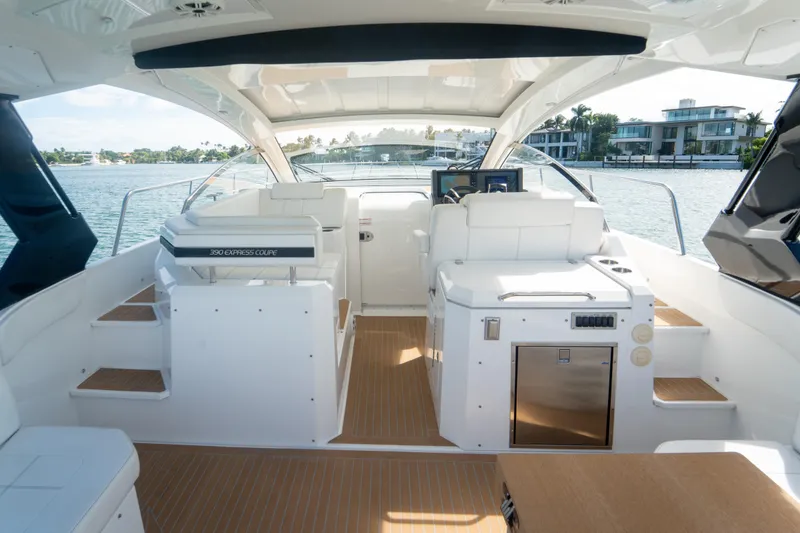 Slide: The Image of 2018 Cruisers Yachts 390 Express Coupe interior with helm, seating, and water view. - 29