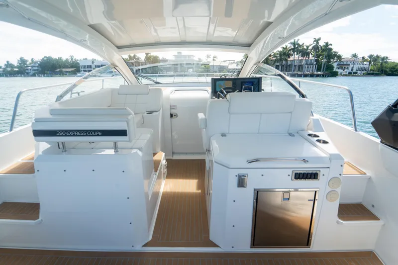 Slide: The Image of 2018 Cruisers Yachts 390 Express Coupe interior with luxurious seating and modern controls. - 30