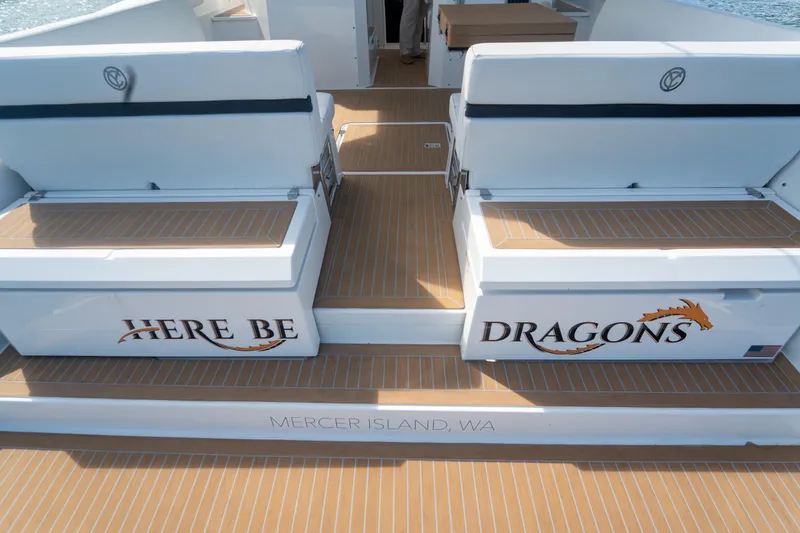 Slide: The Image of 2018 Cruisers Yachts 390 Express Coupe with "Here Be Dragons" text, Mercer Island, WA. - 31