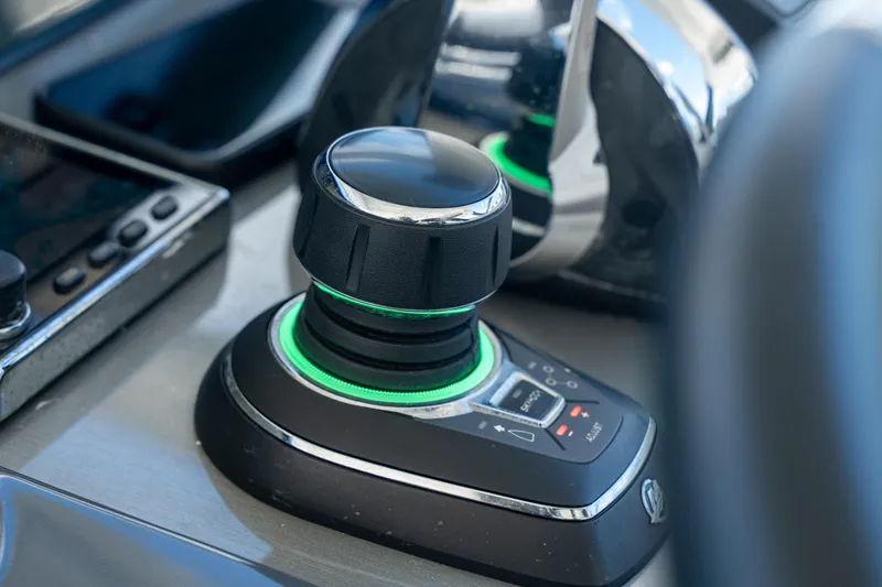 Slide: The Image of Joystick control on 2018 Cruisers Yachts 390 Express Coupe dashboard. - 39