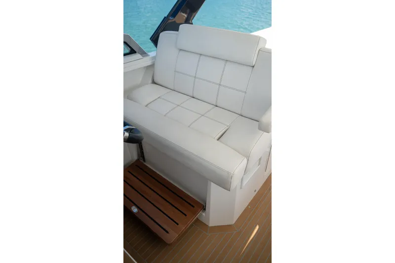 Slide: The Image of Luxurious seating on 2018 Cruisers Yachts 390 Express Coupe, featuring elegant white upholstery. - 42