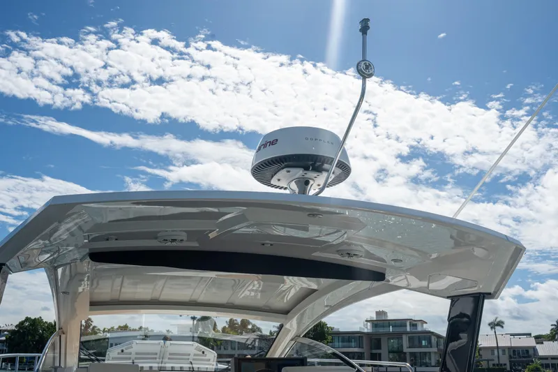 Slide: The Image of 2018 Cruisers Yachts 390 Express Coupe radar system under a clear blue sky. - 44
