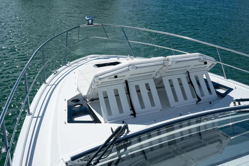 Slide: The Image of 2018 Cruisers Yachts 390 Express Coupe with adjustable sun loungers on deck, cruising on water. - 46