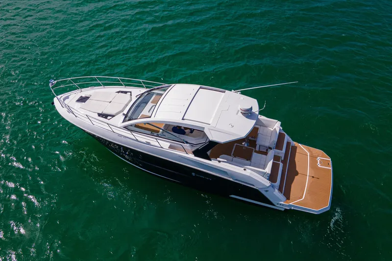 Slide: The Image of 2018 Cruisers Yachts 390 Express Coupe on open water, aerial view. - 9