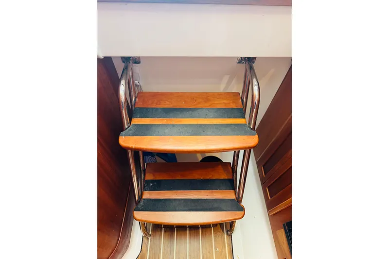 Slide: The Image of Wooden steps with metal rails on a 2007 Back Cove 29 boat interior. - 24