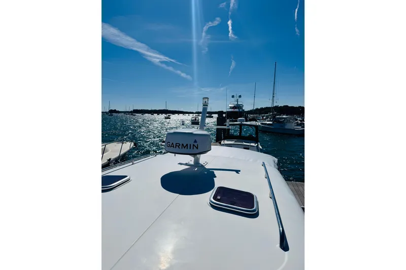 Slide: The Image of 2007 Back Cove 29 boat with Garmin equipment on sunny marina. - 27
