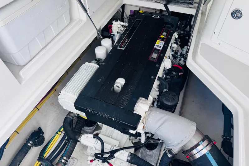 Slide: The Image of Engine compartment of a 2007 Back Cove 29 boat, showcasing detailed machinery. - 32