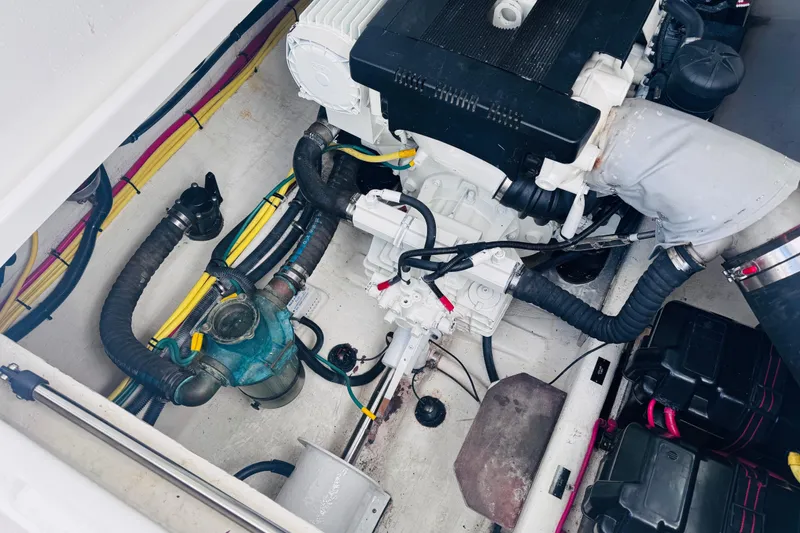 Slide: The Image of Engine compartment of a 2007 Back Cove 29 boat, showcasing wiring and components. - 33