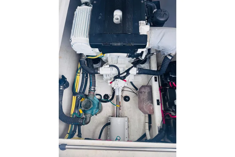Slide: The Image of Engine compartment of a 2007 Back Cove 29 boat, showcasing mechanical components. - 35
