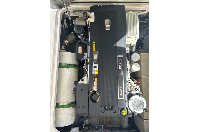 Slide: The Image of Engine compartment of a 2009 Hunt Yachts Harrier 29, featuring a Volvo Penta engine. - 19